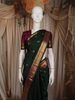Elegant Bottle Green Butta Zari Woven Design Pure Kanchipuram Silk Saree with Contrast Border
