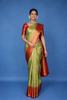 Pista Green Floral Woven Pure Kanchipuram Silk Saree With Contrast Red Zari Border