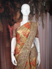 Gold Floral Woven Tissue Banarasi Saree with Heavy Designer Border