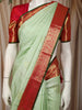 Mint Green Butta Woven Design Pure Kanchipuram Silk Saree with Contrast Zari Border