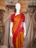 Mustard Orange Paisley Woven Design Pure Kanchipuram Silk Saree with Contrast Woven Border