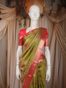 Olive Green Floral Woven Pure Kanchipuram Silk Saree with Contrast Rose Pink Zari Border