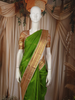 Parrot Green Leaf Butta Zari Woven Design Pure Kanchipuram Silk Saree with Contrast Varisai Pattu Border