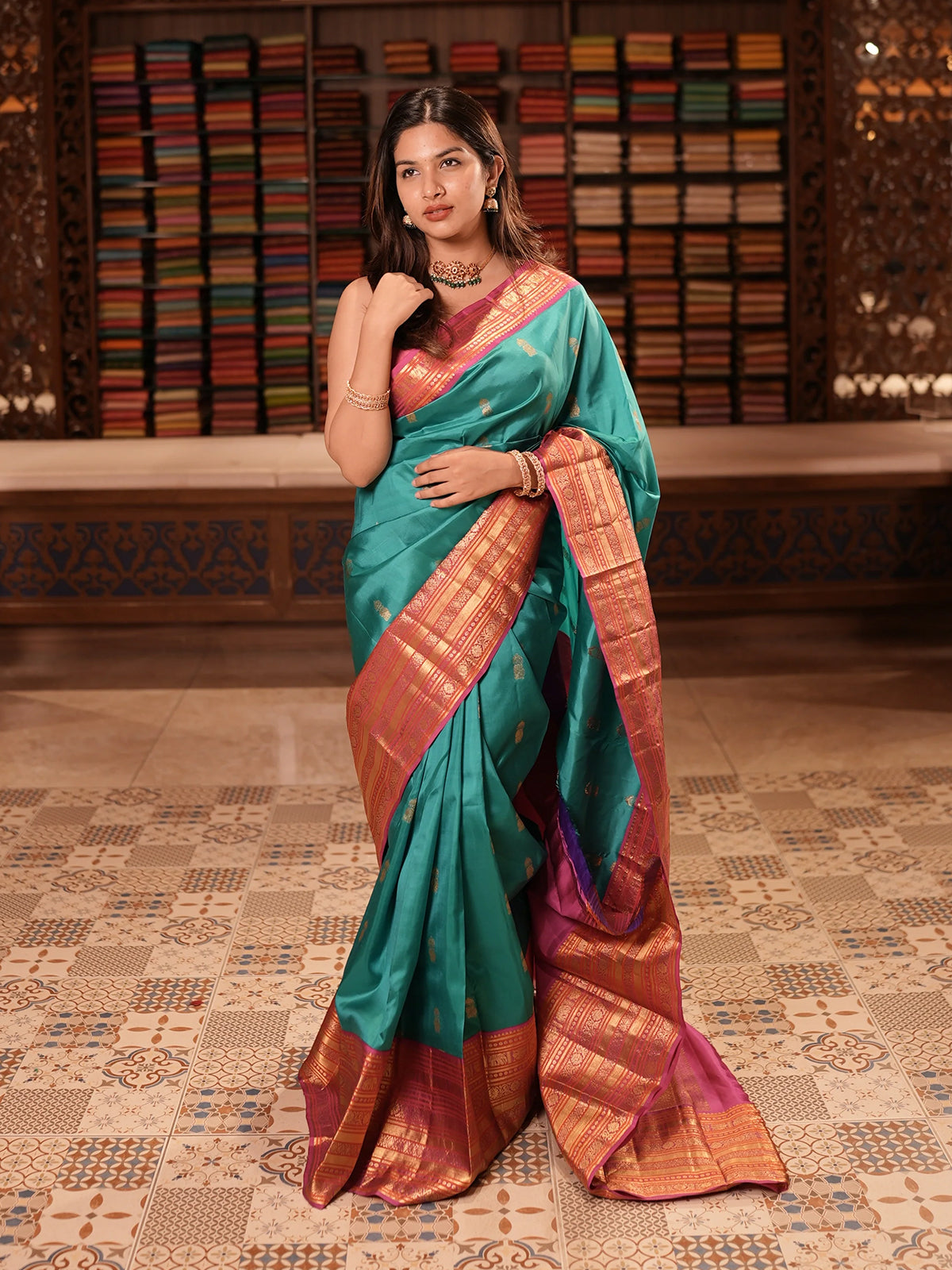 Peacock Blue Butta Zari Woven Design Pure Kanchipuram Silk Saree with Contrast Varisai Pattu Border