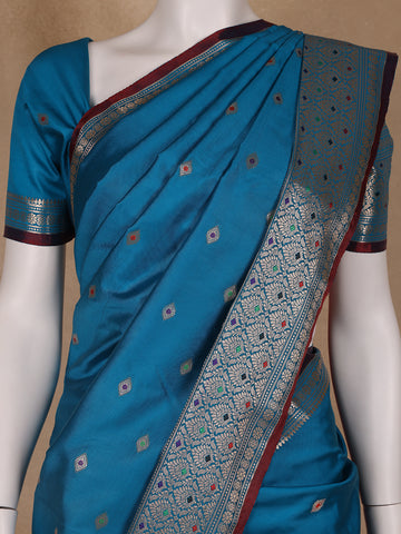 Peacock Blue Floral And Diamond Motifs Zari Weaving Soft Silk Saree - Diadem
