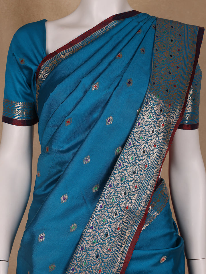 Peacock Blue Floral And Diamond Motifs Zari Weaving Soft Silk Saree - Diadem