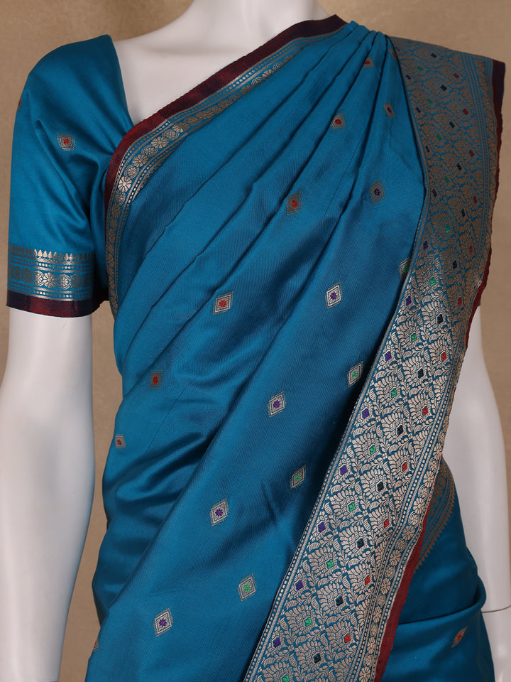 Peacock Blue Floral And Diamond Motifs Zari Weaving Soft Silk Saree - Diadem