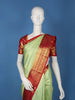 Pista Green Brocade Woven Pure Kanchipuram Silk Saree With Contrast Red Zari Border