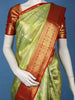 Pista Green Floral Woven Pure Kanchipuram Silk Saree With Contrast Red Zari Border
