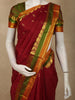 Rich Vermilion Red Butta Zari Woven Design Kanchipuram Silk Saree with Contrast Dual-Tone Paisley Zari Border