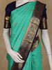Sea Green Butta Woven Pure Kanchipuram Silk Saree With Navy Blue Zari Border