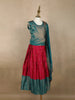 Teal Blue And Dark Pink Floral Zari Woven Raw Silk Pattu Pavadai With Dupatta