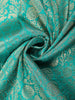 Turquoise Green Banarasi Saree with Floral Design And Designer Border