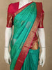 Turquoise Green Butta Zari Woven Design Pure Kanchipuram Silk Saree with Contrast Floral Zari Border