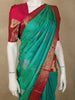 Turquoise Green Butta Zari Woven Design Pure Kanchipuram Silk Saree with Contrast Floral Zari Border