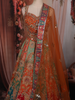 Vibrant Burnt Orange Floral and Birds Motif Sequins Embroidered Design Banarasi Silk Lehenga with Dupatta