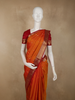 Warm Burnt Orange Floral Butta Woven Design Pure Kanchipuram Silk Saree with Contrast Peacock Zari Border