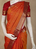 Warm Burnt Orange Floral Butta Woven Design Pure Kanchipuram Silk Saree with Contrast Peacock Zari Border