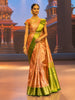 Warm Orange Floral Zari Woven Design Pure Kanchipuram Silk Bridal Saree with Contrast Green Zari Border