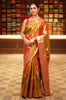 Burnt Orange and Green Floral Zari Woven Design Tissue Silk Fancy Saree with Zari Border