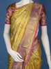 Yellow Floral Woven Pure Kanchipuram Silk Saree With Contrast Pink Zari Border