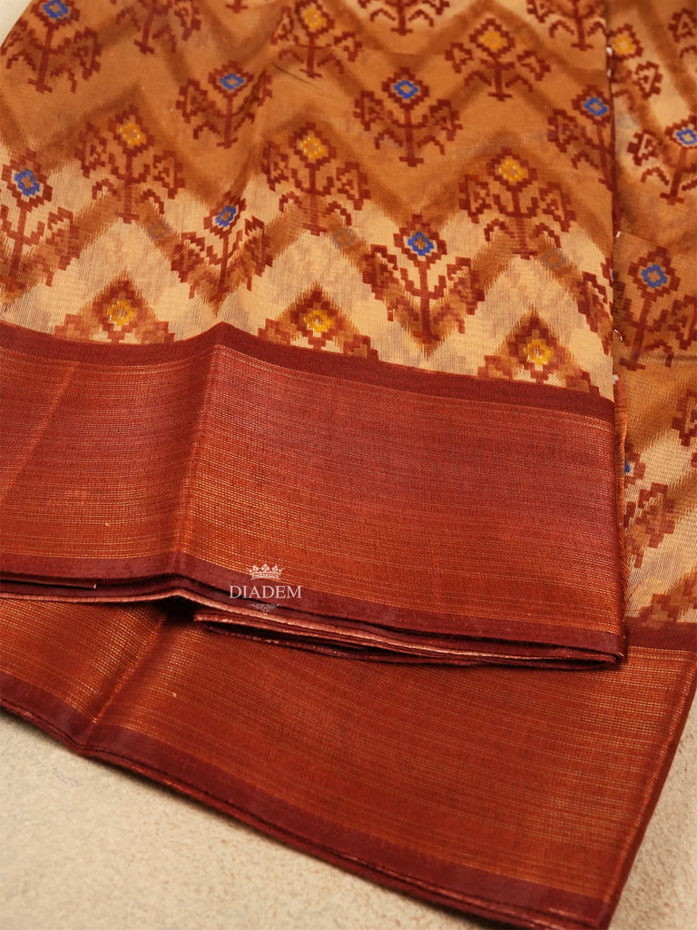 Elegant Brown Saree with Floral Patterns