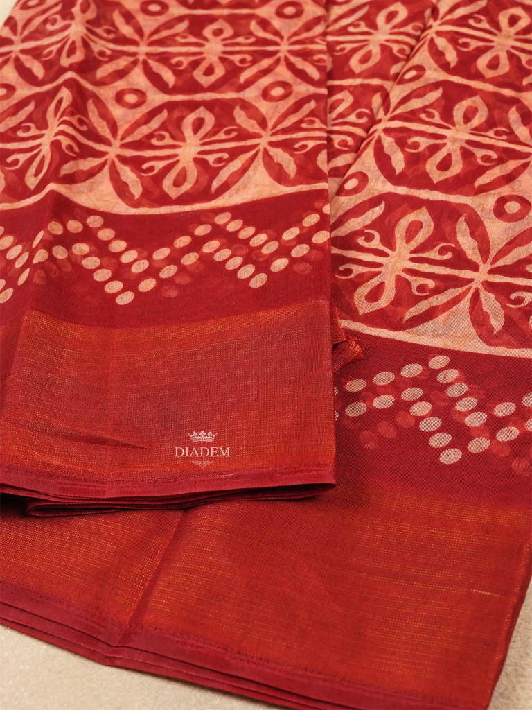 Elegant Red Saree with Floral Patterns