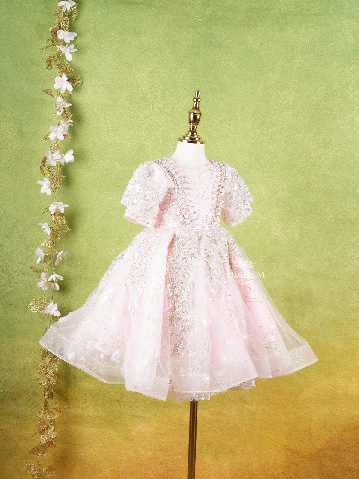 Pale Pink Net Gown Adorned With Floral Designs and Puff Sleeves