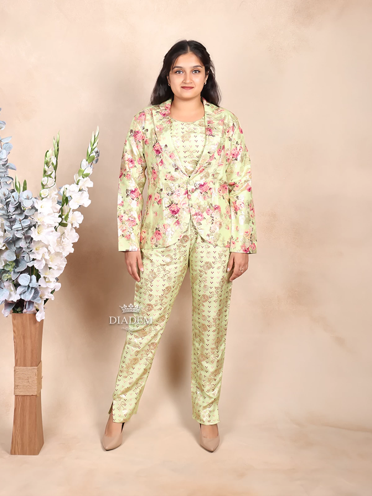 Pista Green Pant Suit Adorned with Floral Prints paired with Matching Overcoat